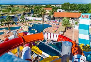 an image of a water slide at a resort at Camping Club Les Tamaris - Maeva in Le Barcarès