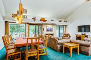 a living room with a table and a couch at 16 Lassen Lane in Sunriver