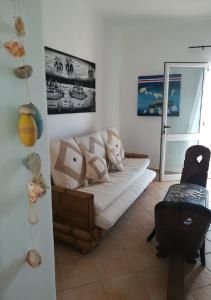 a living room with a couch in the corner at Apartments Mistral Estoril Beach in Sal Rei