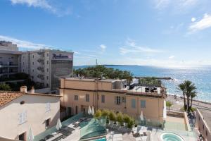 a view of the ocean from a building at Blue Dreams YourHostHelper in Cannes