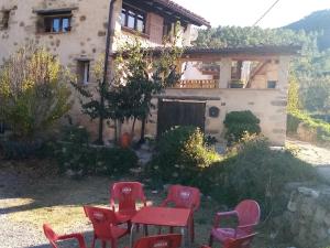 a table and chairs in front of a house at LA MANDUCA in Teruel