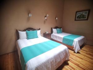 Postel nebo postele na pokoji v ubytování Hotel Boutique Casa de las Manrique