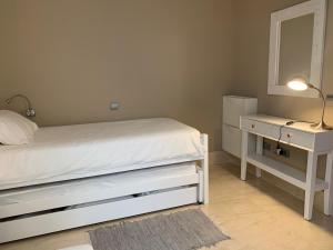 Ein Bett oder Betten in einem Zimmer der Unterkunft Apartamento Balcón del Puerto