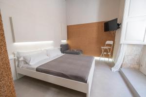 A bed or beds in a room at Casa Berenice