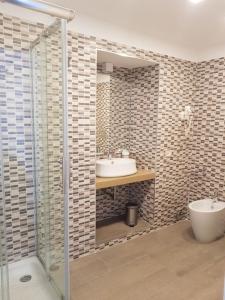a bathroom with a sink and a shower at Savoy Riviera in Naples