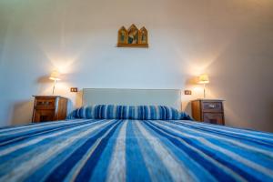 A bed or beds in a room at Il Casone