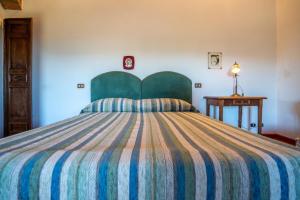 A bed or beds in a room at Il Casone