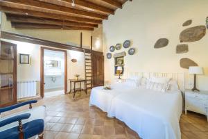 Llit o llits en una habitació de Hotel Rural Las Calas