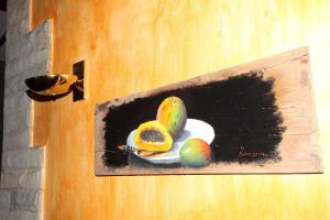 a painting of a bowl of fruit on a wall at VACACIONAL LA TEA THE BEST LOCATION and THE BEST VIEWS in Tejeda