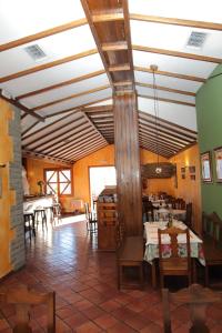 a dining room with tables and chairs in a building at VACACIONAL LA TEA THE BEST LOCATION and THE BEST VIEWS in Tejeda