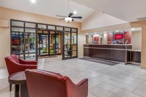 a lobby with chairs and a bar in a store at Red Roof Inn Phoenix North - I-17 at Bell Rd in Phoenix
