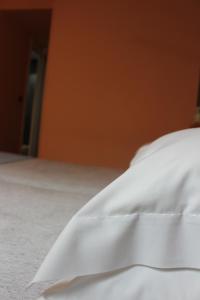 Posteľ alebo postele v izbe v ubytovaní Hotel Zarampallo