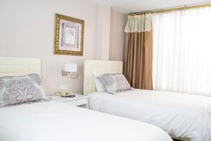 Voodi või voodid majutusasutuse Hotel Sandmelis toas