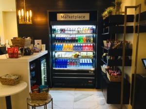 a refrigerator filled with lots of drinks in a store at Crowne Plaza Fredericton Lord Beaverbrook by IHG in Fredericton +282 photos