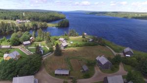 an aerial view of a house on an island in the water at Crowne Plaza Fredericton Lord Beaverbrook, an IHG Hotel in Fredericton