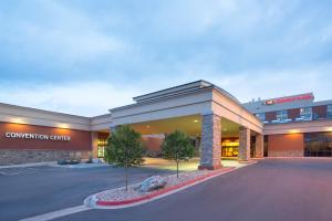 a convention center building with a parking lot in front at Crowne Plaza Denver International Airport, an IHG Hotel in Denver