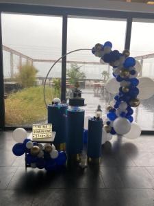 a group of blue and white balloons in a room at Hotel Terme Neronensis in Pozzuoli
