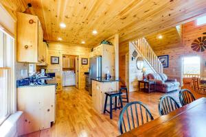 a kitchen and living room in a log cabin at Mountain Laurel View in Blue Ridge