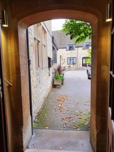 an entrance to a building with an open door at Stow Lodge Hotel in Stow on the Wold