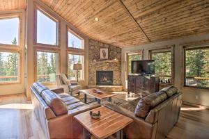 a living room with leather furniture and a fireplace at Fairplay Dream Escape 27 Miles to Breckenridge! in Fairplay