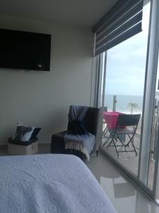 Zona de estar de Departamento frente al mar en Portico Beach Condos