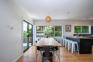 a kitchen and dining room with a table and chairs at Lakeview Lookout in Taupo