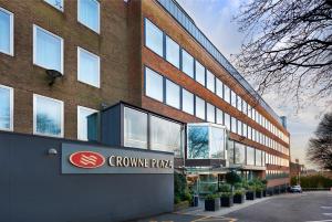 a brick building with a sign on the side of it at Crowne Plaza London Ealing by IHG in London