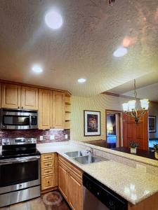 a kitchen with a sink and a stove at Westgate Resort Park City, Utah in Park City