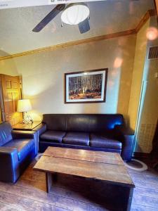 a living room with a leather couch and a coffee table at Westgate Resort Park City, Utah in Park City
