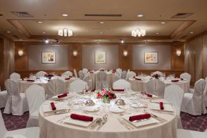 a banquet room with white tables and white chairs at ANA Crowne Plaza Kanazawa by IHG in Kanazawa