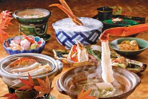 a table topped with different types of food at ANA Crowne Plaza Kanazawa by IHG in Kanazawa