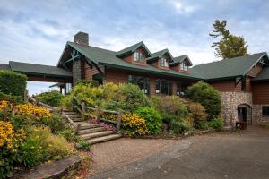 a house with a staircase in front of it at Crowne Plaza Lake Placid by IHG in Lake Placid