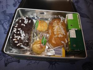 a box of different types of pastries in a box at Nido Dei Gabbiani in Naples