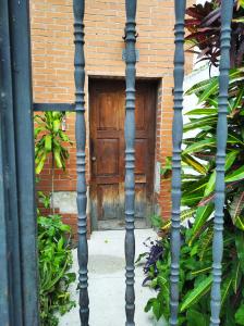 an entrance to a brick building with a wooden door at Candida in Caracas