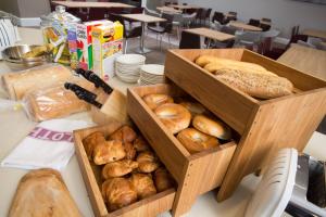 two wooden boxes filled with different types of bread at Staybridge Suites Birmingham, an IHG Hotel in Birmingham
