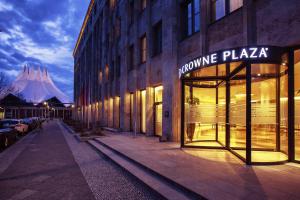 a building with a sign that reads upcoming plaza at Crowne Plaza Berlin - Potsdamer Platz, an IHG Hotel in Berlin