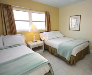 Postel nebo postele na pokoji v ubytování Quebec Motel