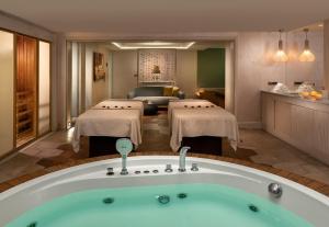 a room with a jacuzzi tub in a hotel at Crowne Plaza Florya Istanbul by IHG in Istanbul