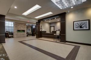 an empty lobby with a hair salon at Staybridge Suites Plano - The Colony, an IHG Hotel in The Colony