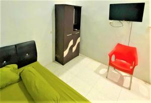 Μια τηλεόραση ή/και κέντρο ψυχαγωγίας στο Radja Guest House +17 φωτογραφίες