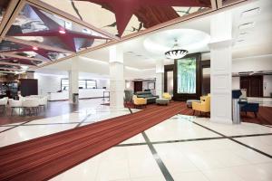an open lobby with a rug on the floor at Fort Pontchartrain Detroit, a Wyndham Hotel in Detroit +155 photos