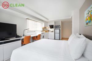 Un televizor și/sau centru de divertisment la Wilby Central Serviced Apartments