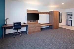 a room with a desk with a computer and a chair at Holiday Inn Express Hollywood Walk of Fame by IHG in Los Angeles