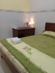Giường trong phòng chung tại The Light House - Comfortable house near Mui Dien