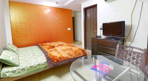 Postel nebo postele na pokoji v ubytování SSS Group Hotel, Dwarka, New Delhi