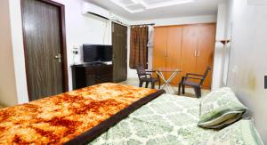 TV a/nebo společenská místnost v ubytování SSS Group Hotel, Dwarka, New Delhi