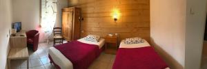 Postel nebo postele na pokoji v ubytování Abel Hôtel