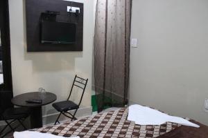 Ένα ή περισσότερα κρεβάτια σε δωμάτιο στο Hotel Samar