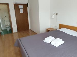Postel nebo postele na pokoji v ubytování Sobe MaMaLu