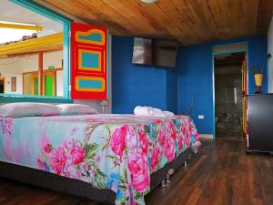 Un pat sau paturi într-o cameră la Casa Pachamama